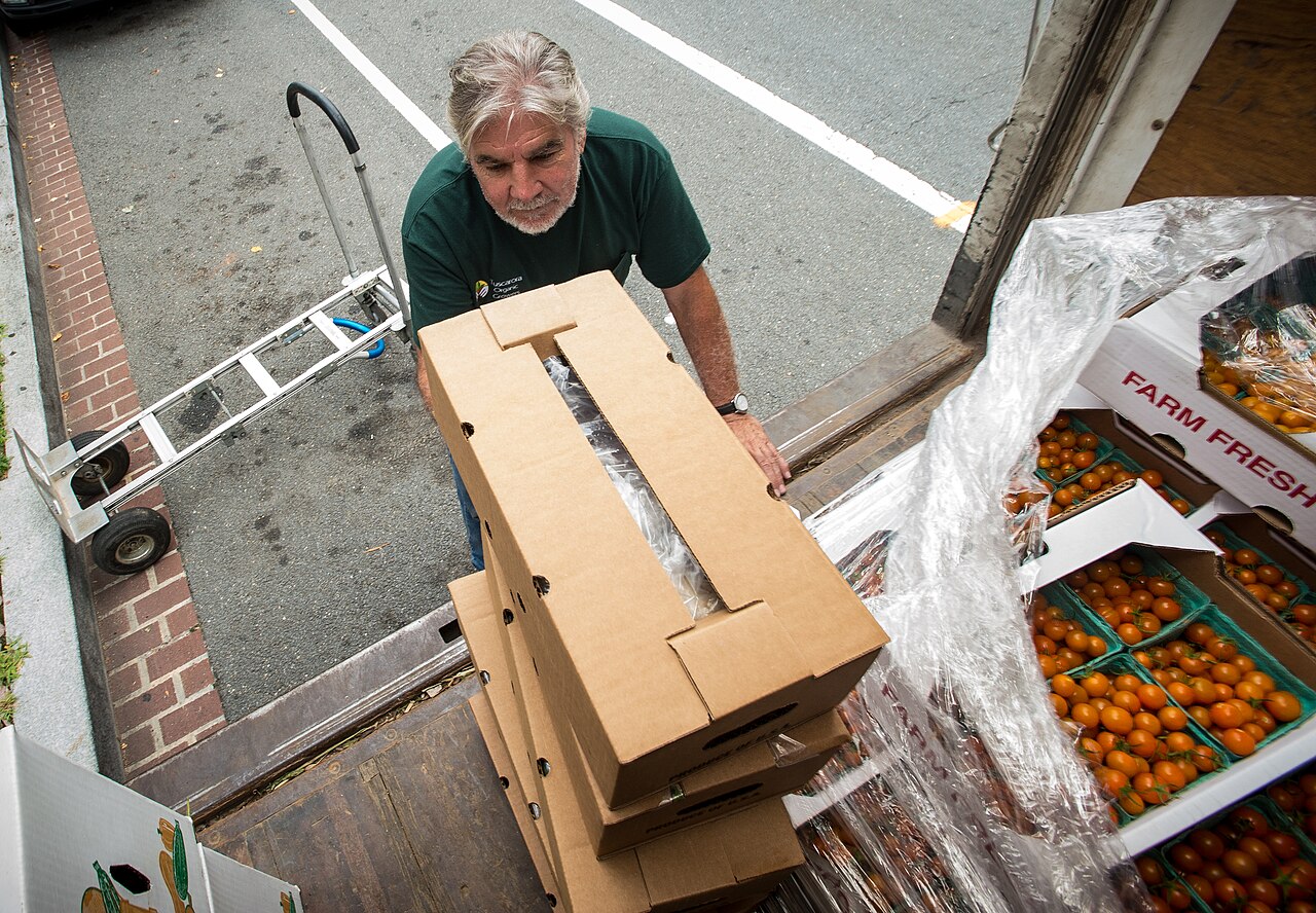 Close-up of USDA Organic certified seal on fresh produce packaging in a grocery store